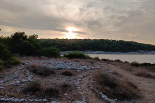 A rocky shoreline at sunset, Croatia